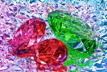 Precious stones, jewelry on the background of silver foilの写真素材