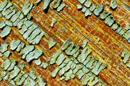 The texture of old,cracked,paint on a wooden Board.の写真素材