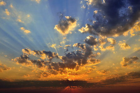 Cloudy sky in the background of the rising sun