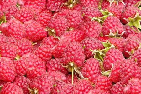 Background of the ripe,fresh,juicy berries of raspberry.