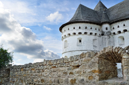 Ancient, defensive church on the background of the blue skyの写真素材