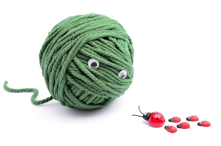 Clew of green thread for knitting isolated on white backgroundの写真素材