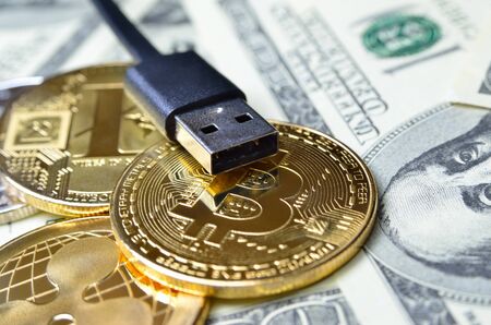 Digital cryptocurrency in the background of the american dollar.の写真素材
