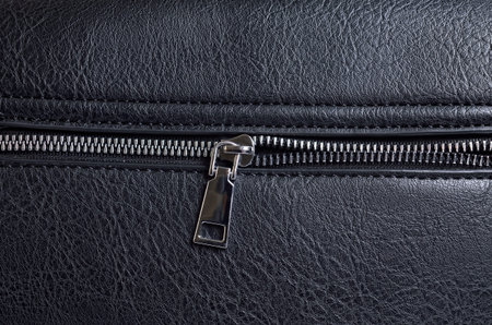 Rough black animal leather texture with zipper