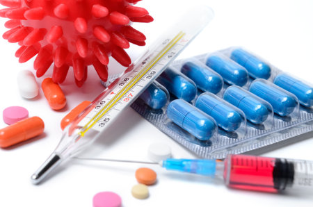 Pharmacy and medical supplies on a white background. Vaccine and medications for treatment of...