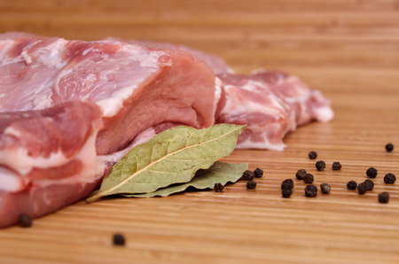 A piece of raw meat on a cutting kitchen table