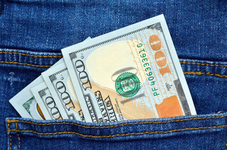 American money in the pocket of blue jeans