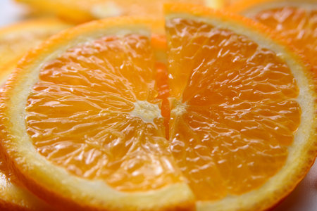 Dessert of ripe, juicy orange sliced into pieces, close-upの写真素材