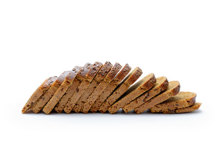 Sliced loaf of rye bread on white backgroundの写真素材