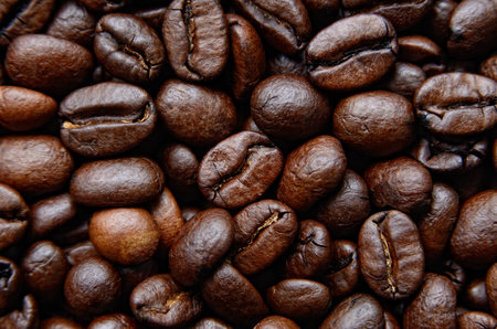 Roasted coffee beans background, close-up viewの写真素材