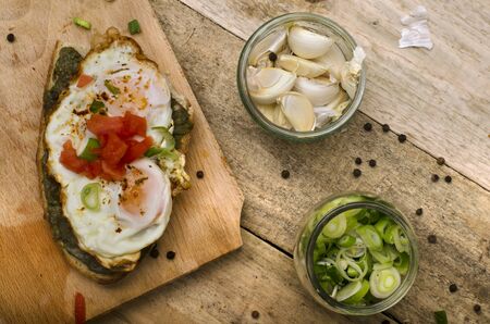 Toast lunch with spinach and egg, garlic and onionの写真素材