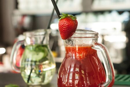 Strawberry lemonade on the counter waiting for a thirsty customerの写真素材