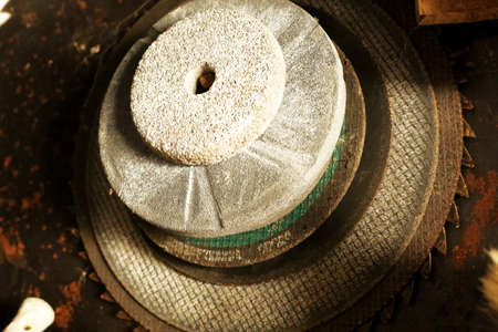 Old abreasive wheels in forgotten workshopの写真素材