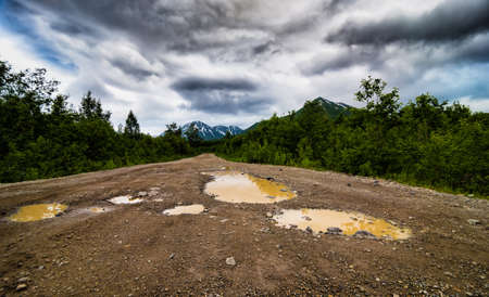 The dirt road and view in Kamchatka Peninsulaの写真素材