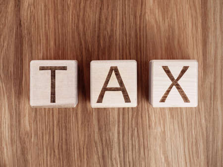 Text on wooden blocks as a tax payment conceptの写真素材
