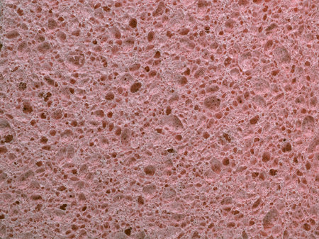 Abstract background with the texture of a beige washing sponge