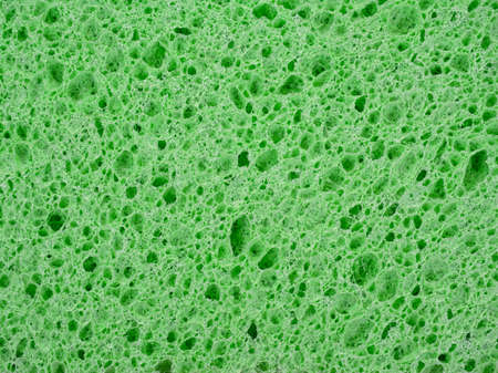 Abstract background of green washing sponge textureの写真素材
