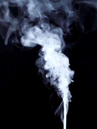 Effect of rising white smoke on a blackの写真素材