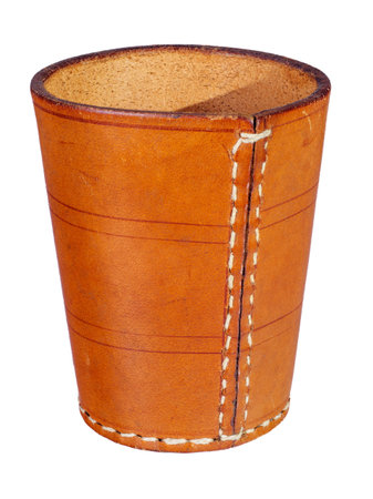 Single leather dice cup isolated on whiteの写真素材