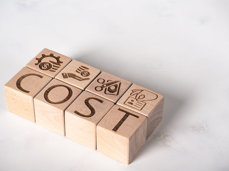 Text on wooden cubes as cost, expense or profit and loss conceptの写真素材