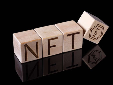 Word NFT on wood blocks as new concept of digital tradingの写真素材