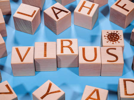 Pandemic or epidemic concept as an VIRUS text inscription on wooden cubesの写真素材