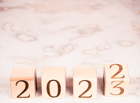 Text 2023 on wooden blocks as motivation, new goals and plans concept