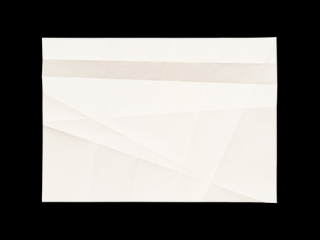White blank wrinkled paper texture isolated on black backgroundの写真素材