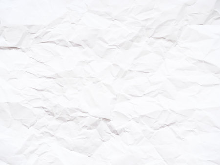 Textured background made of crumpled and wrinkled white paperの写真素材