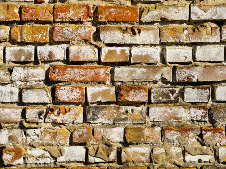 Texture of old brick wall destroyed by weather and timeの写真素材