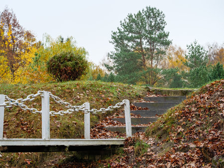 Iron bridge with handrails made of chains to the steps going upの写真素材