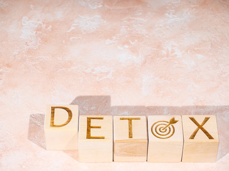 DETOX text on wooden cubes as a body cleansing conceptの写真素材