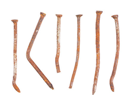 Set of old deformed and rusted nails close-up, isolated on white backgroundの写真素材