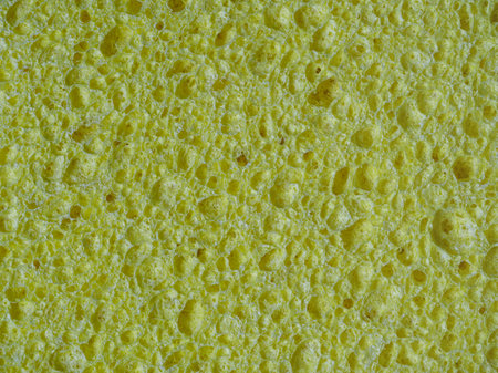 Yellow wash sponge, texture of porous sponge close-upの写真素材