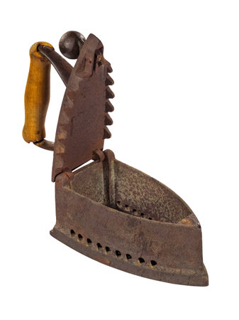 Antique rusty charcoal iron with the lid open isolated on white backgroundの写真素材