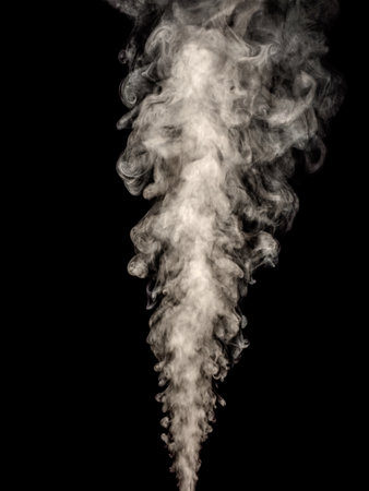 White smoke steam rising up against a black backgroundの写真素材