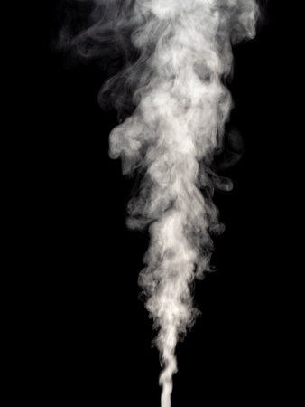 Puffs and curls of white smoke isolated on a black backgroundの写真素材