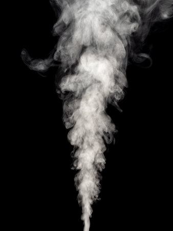 A jet of white smoke rises upward, isolated against a black backgroundの写真素材