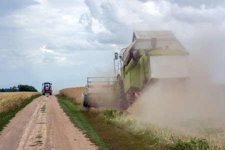 The combine harvester rape, and the tractor goes to unload it.