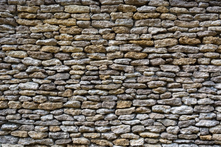 background of limestone walls, densely piled stones.