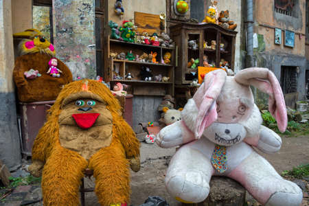 Lviv, Ukraine - April 28, 2018: yard abandoned toys of children, including dolls, teddy bears and many othersのeditorial素材