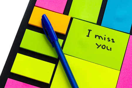 multi-colored stickers for notes of different sizes and shapes with a markerの写真素材