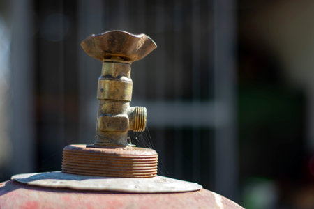 valve of an old gas cylinder in a garage.