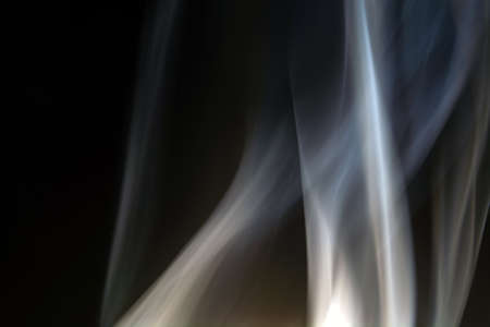 floating, defocused smoke on a black background.の写真素材