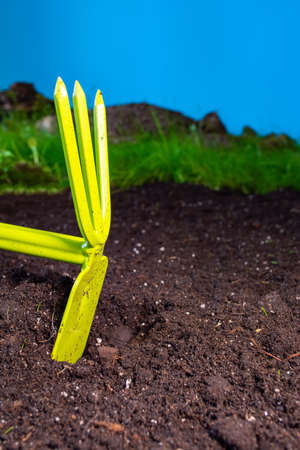 hand weeding grass with garden tools.の写真素材