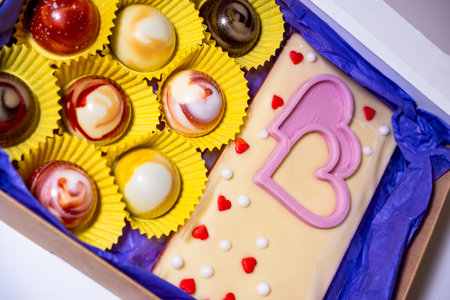colorful, glossy candies and handmade chocolates.の写真素材