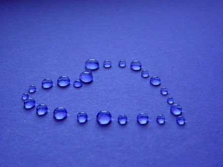Contour heart of drops on a blue backgroundの写真素材