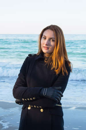 Beautiful and style redhead young woman on seaside.の写真素材