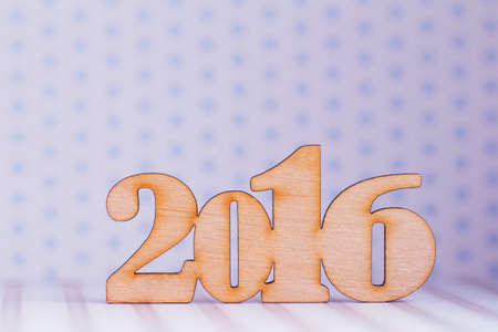 Wooden inscription of 2016 year on light background.の写真素材
