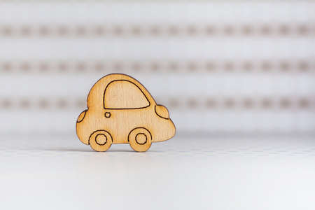 Wooden car icon on light spotted background.の写真素材